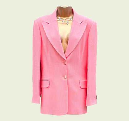 Pink blazer on a mannequin against a light beige background