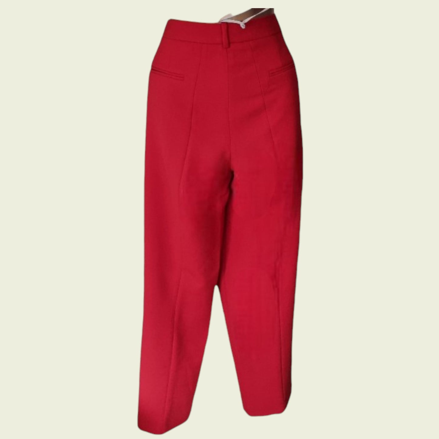 Red pants on a beige background