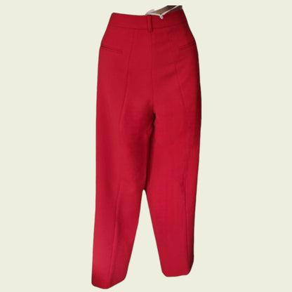 Red pants on a beige background