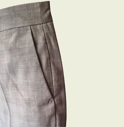 Close-up of trouser pocket on a beige background