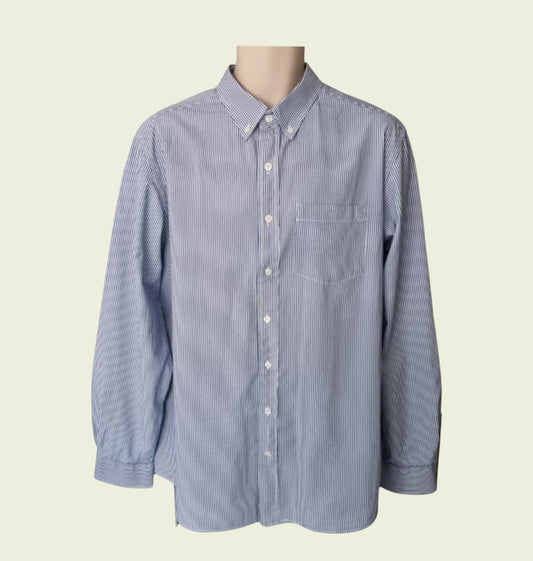 Blue striped shirt on a mannequin against a beige background