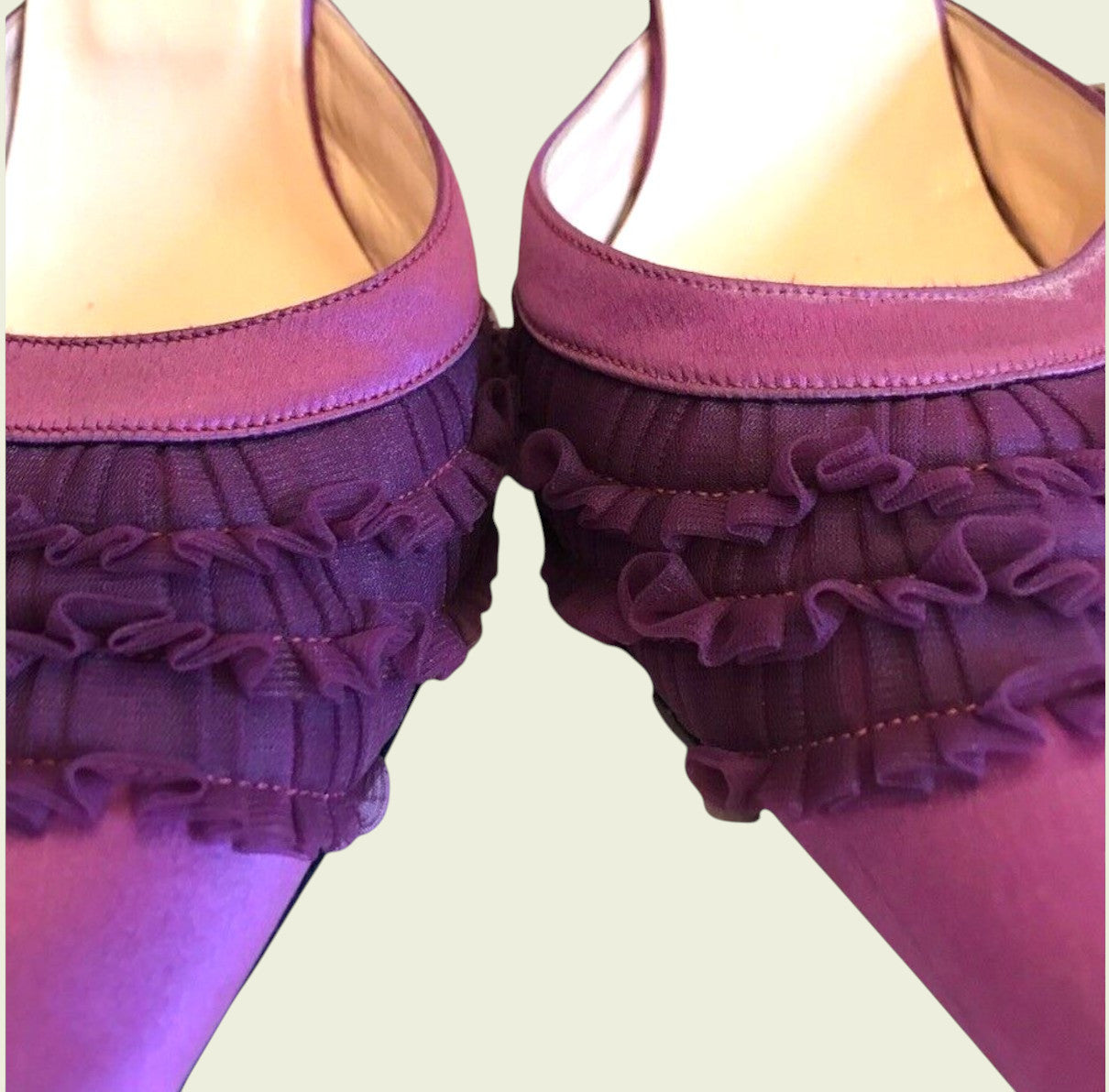 Purple ruffled underwear set on a plain background