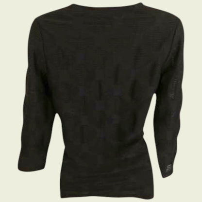 Navy long-sleeve shirt on a beige background