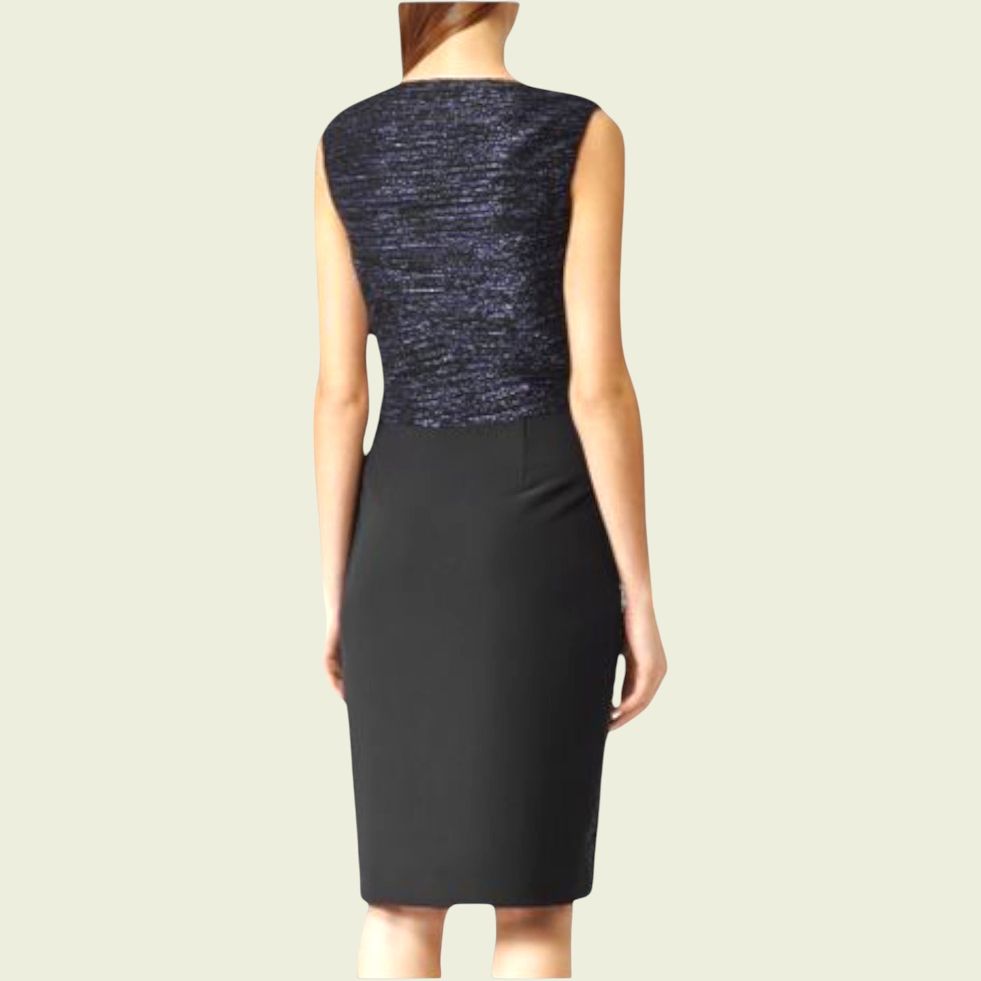 Navy blue dress with a textured top on a beige background