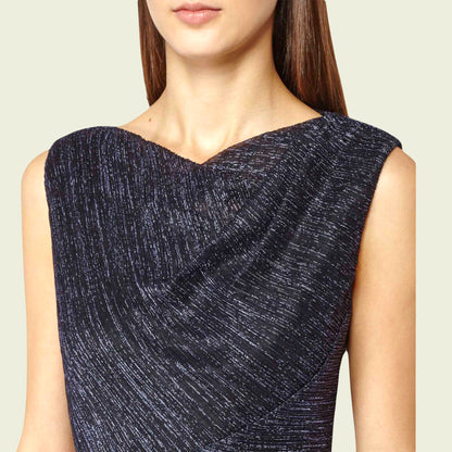 Navy blue textured dress worn by a model on a light beige background