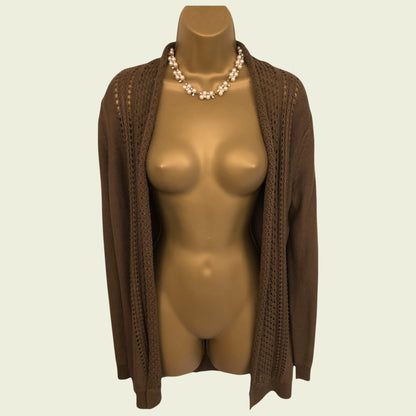 Mannequin wearing a brown cardigan on a beige background