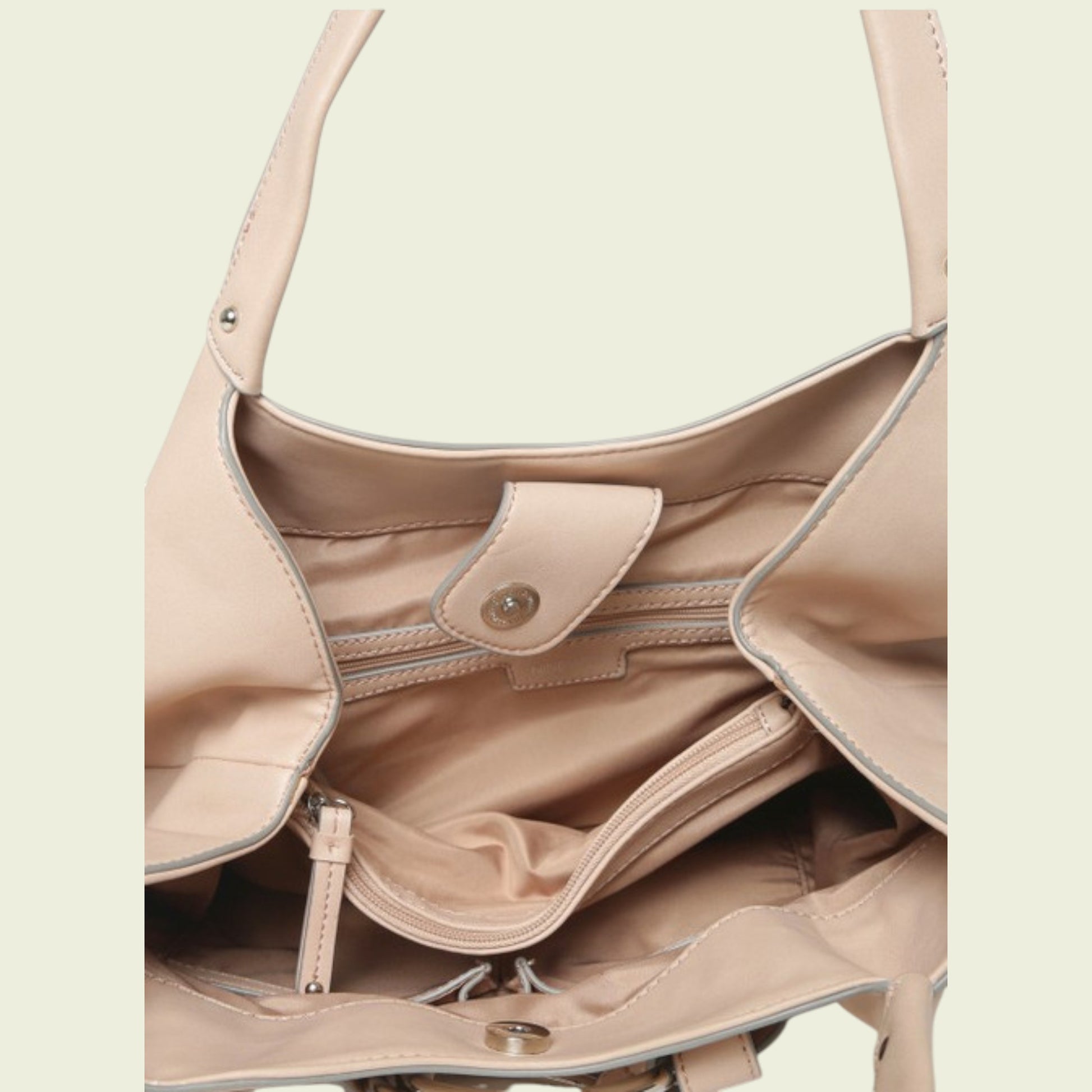 Close-up of inside of pink  handbag with a light background