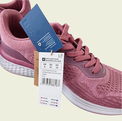 Pink running shoe with a tag on a beige background