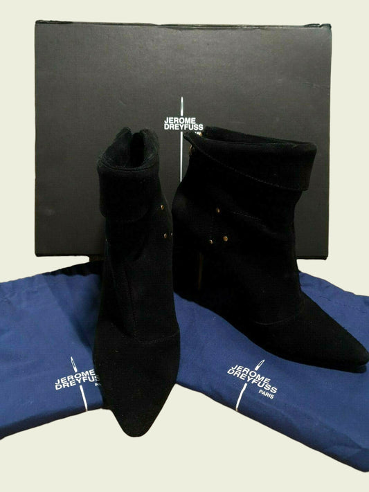 Black suede boots with gold buttons on a blue Jerome Dreyfuss branded mat and box.