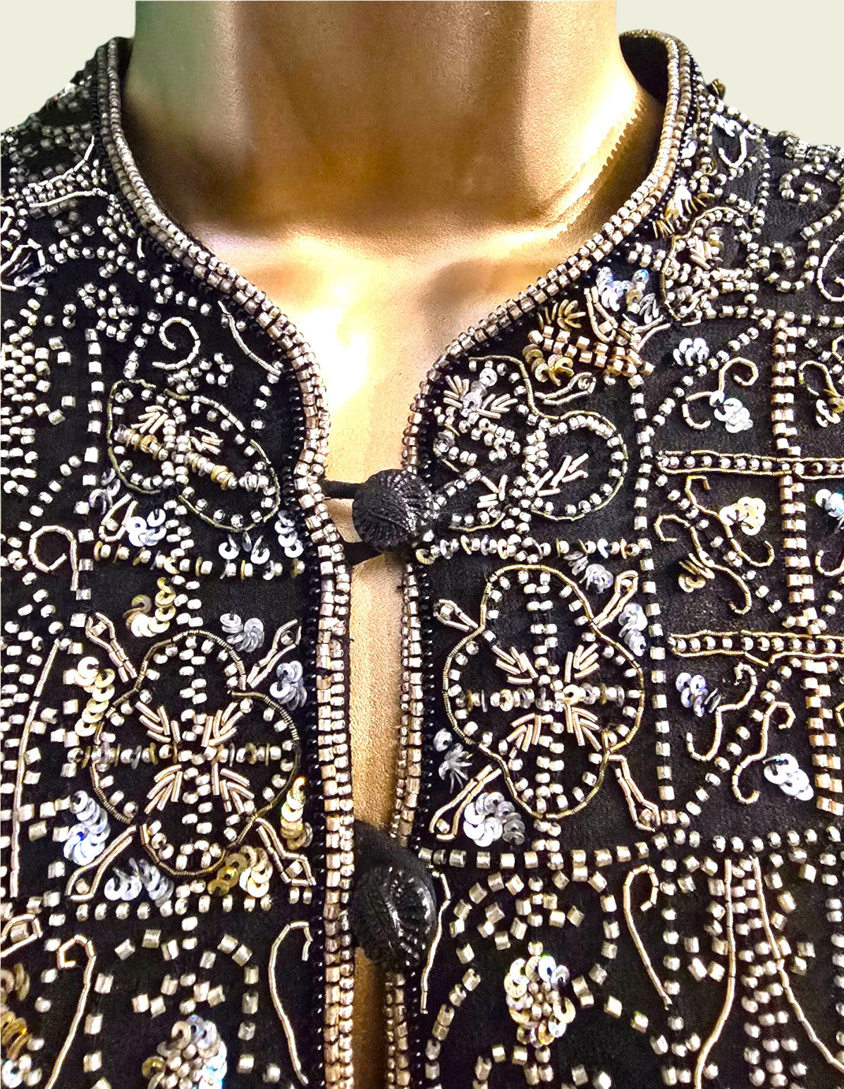 Black embroidered garment on a mannequin