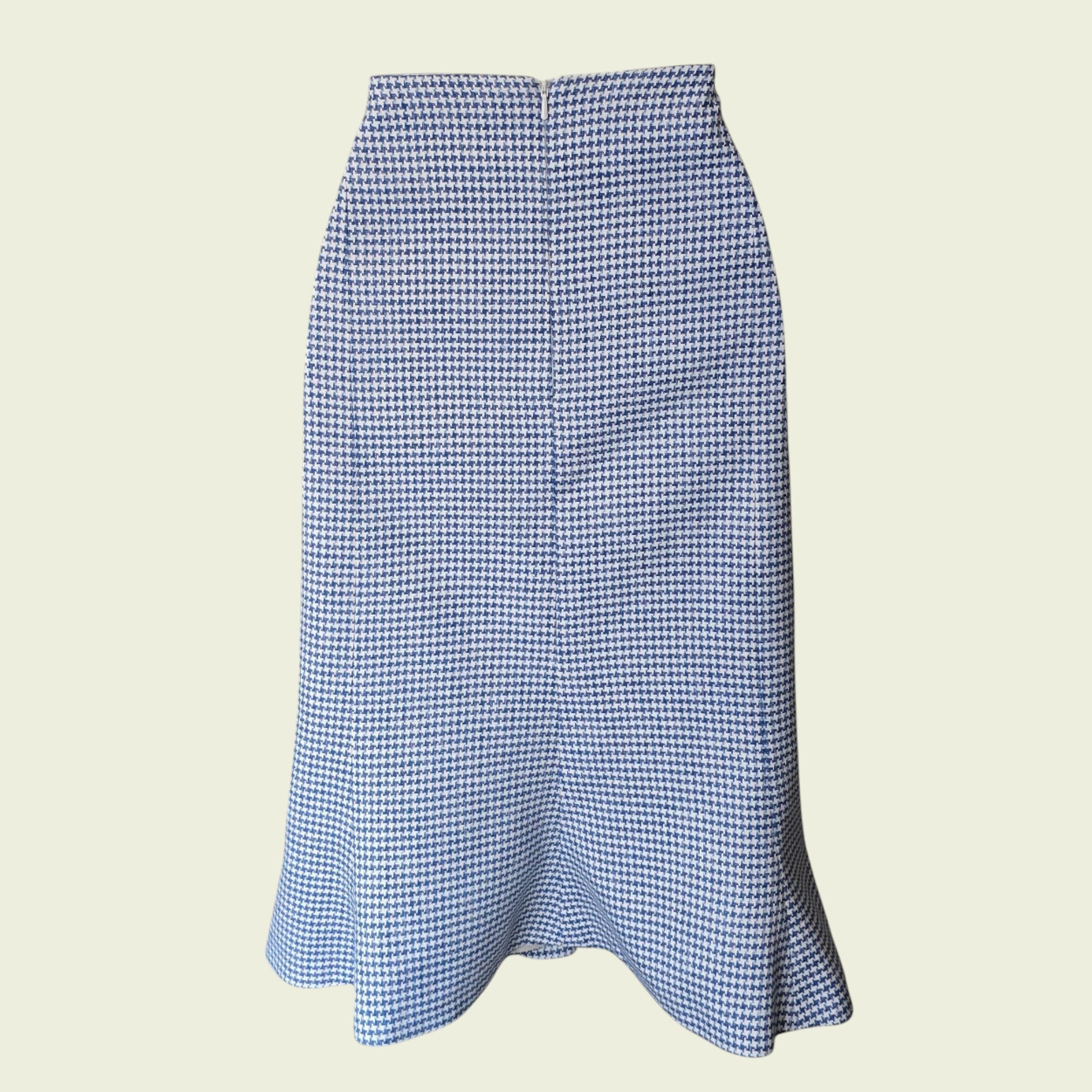 Blue and white checkered skirt on a beige background
