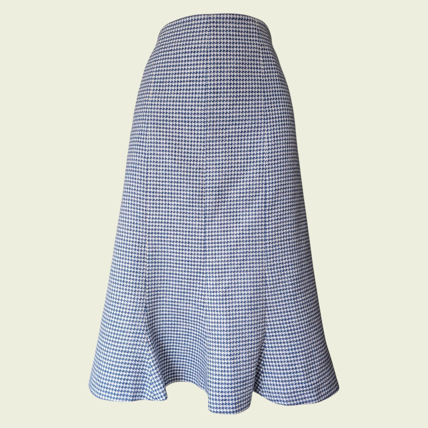 Blue and white checkered skirt on a beige background
