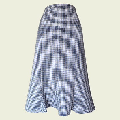 Blue and white checkered skirt on a beige background