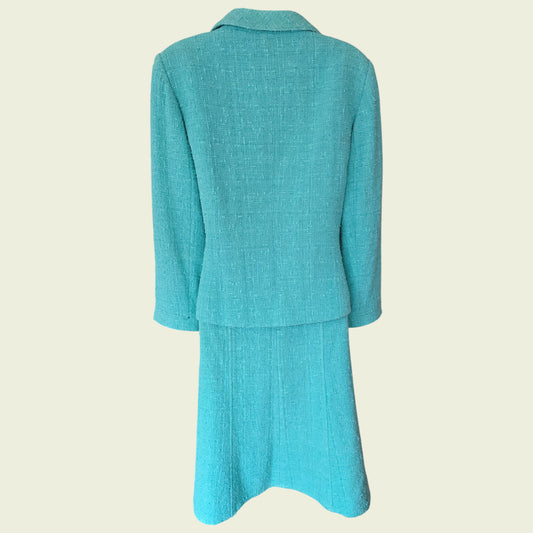 Turquoise suit on a beige background