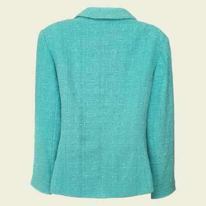 Turquoise blazer on a beige background