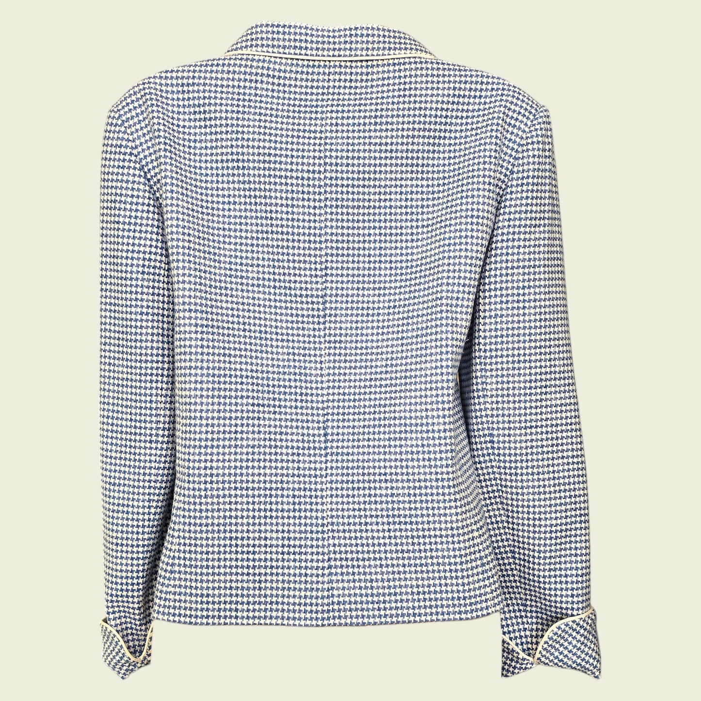 Blue and white checkered jacket on a beige background