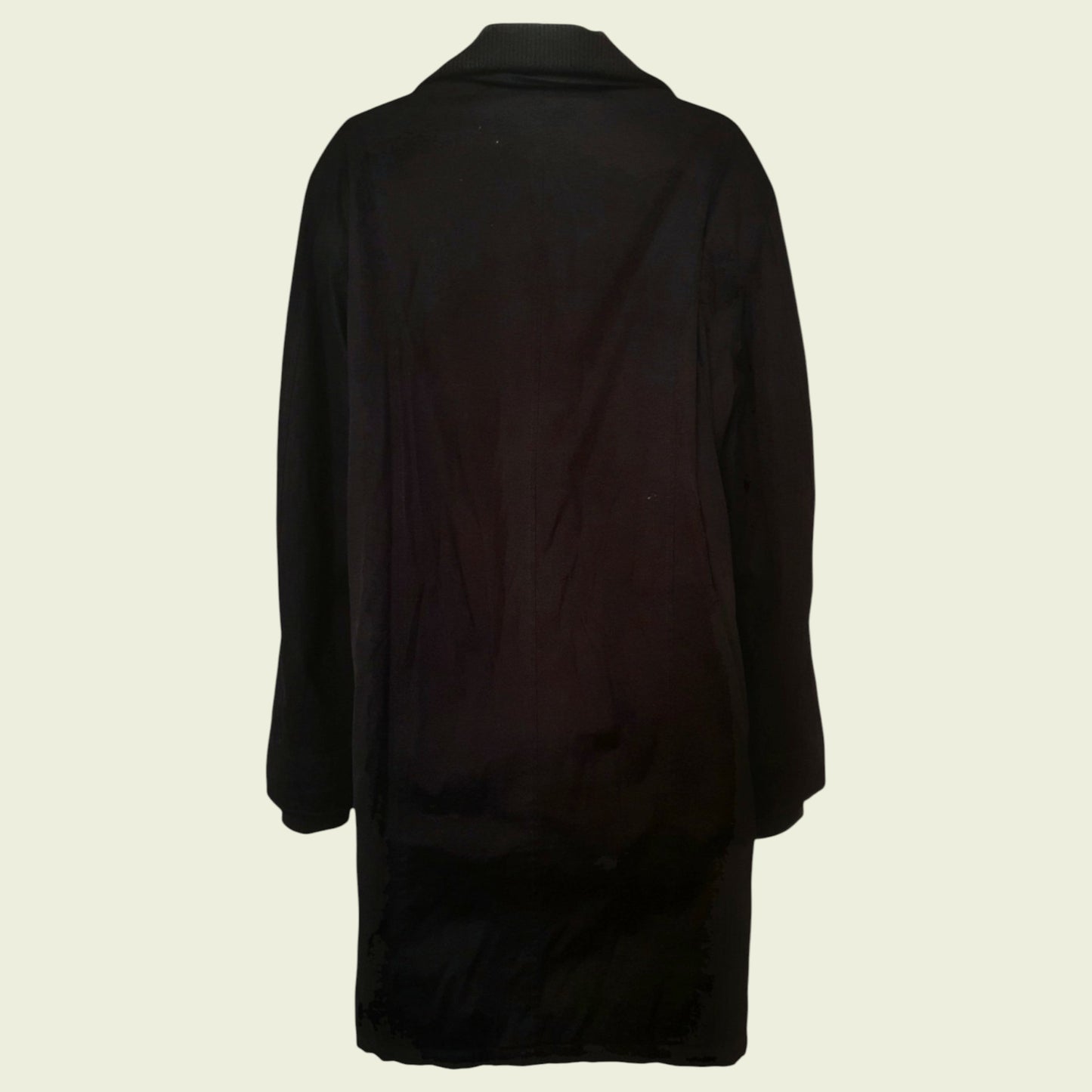 Black coat on a beige background