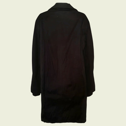 Black coat on a beige background