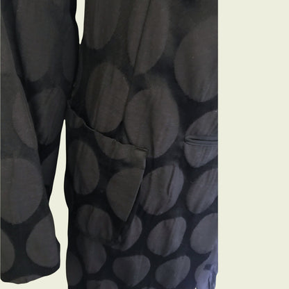 Black patterned fabric on a beige background