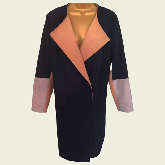 Black coat with pink and grey accents on a beige background