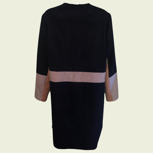 Black coat with pink and grey accents on a beige background