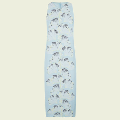 Light blue dress with black and white pattern on a beige background
