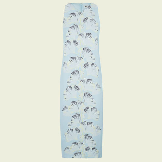 Light blue dress with black and white pattern on a beige background