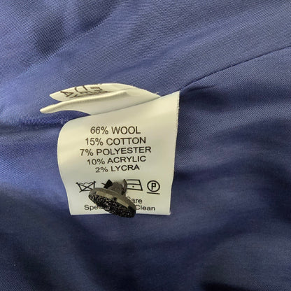 Clothing label on a blue fabric background with fabric texture