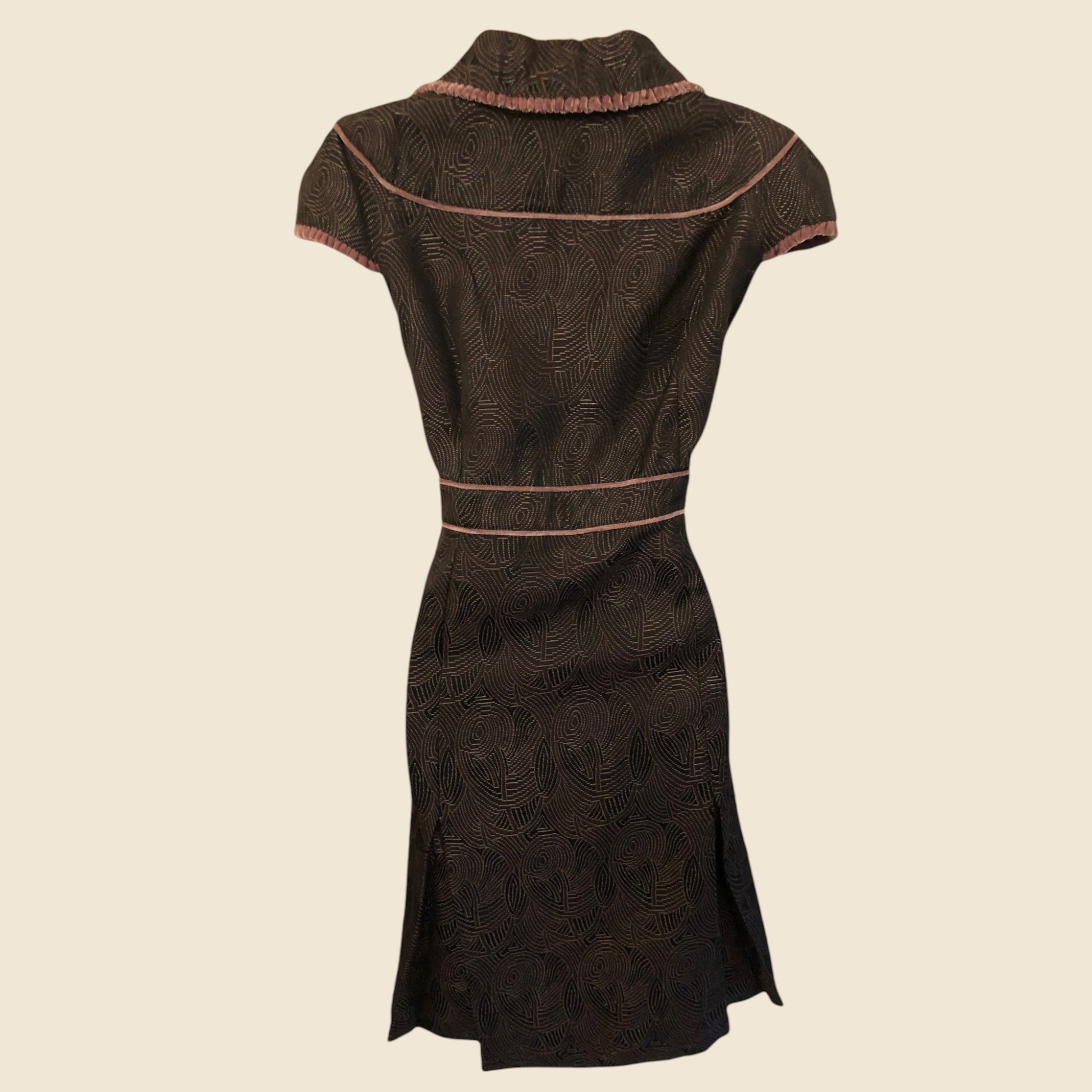 Dark brown dress with pattern on a beige background