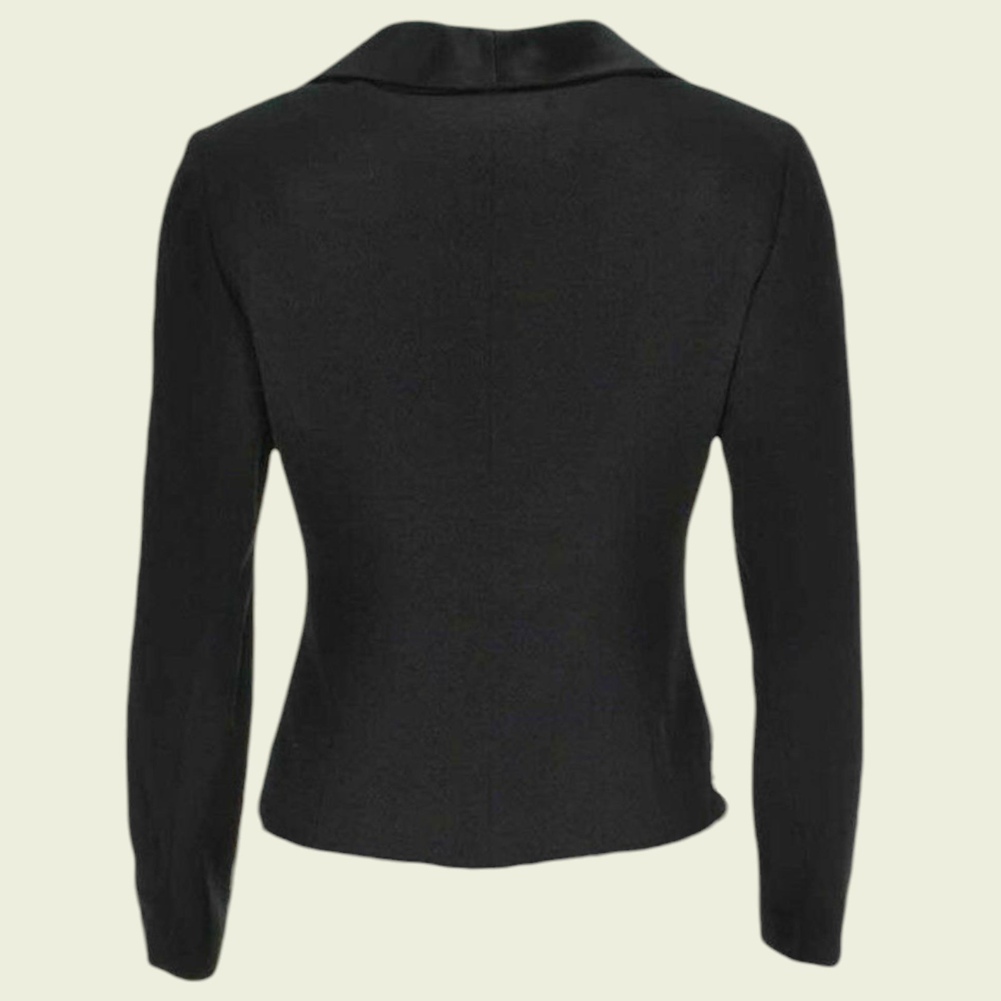 Black long-sleeve top on a beige background