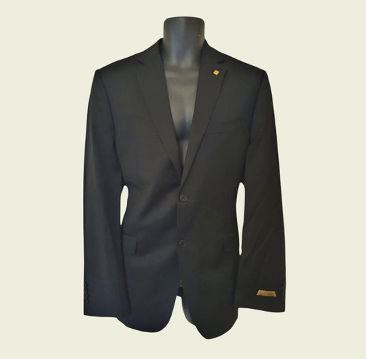 Black suit jacket on a mannequin against a beige background