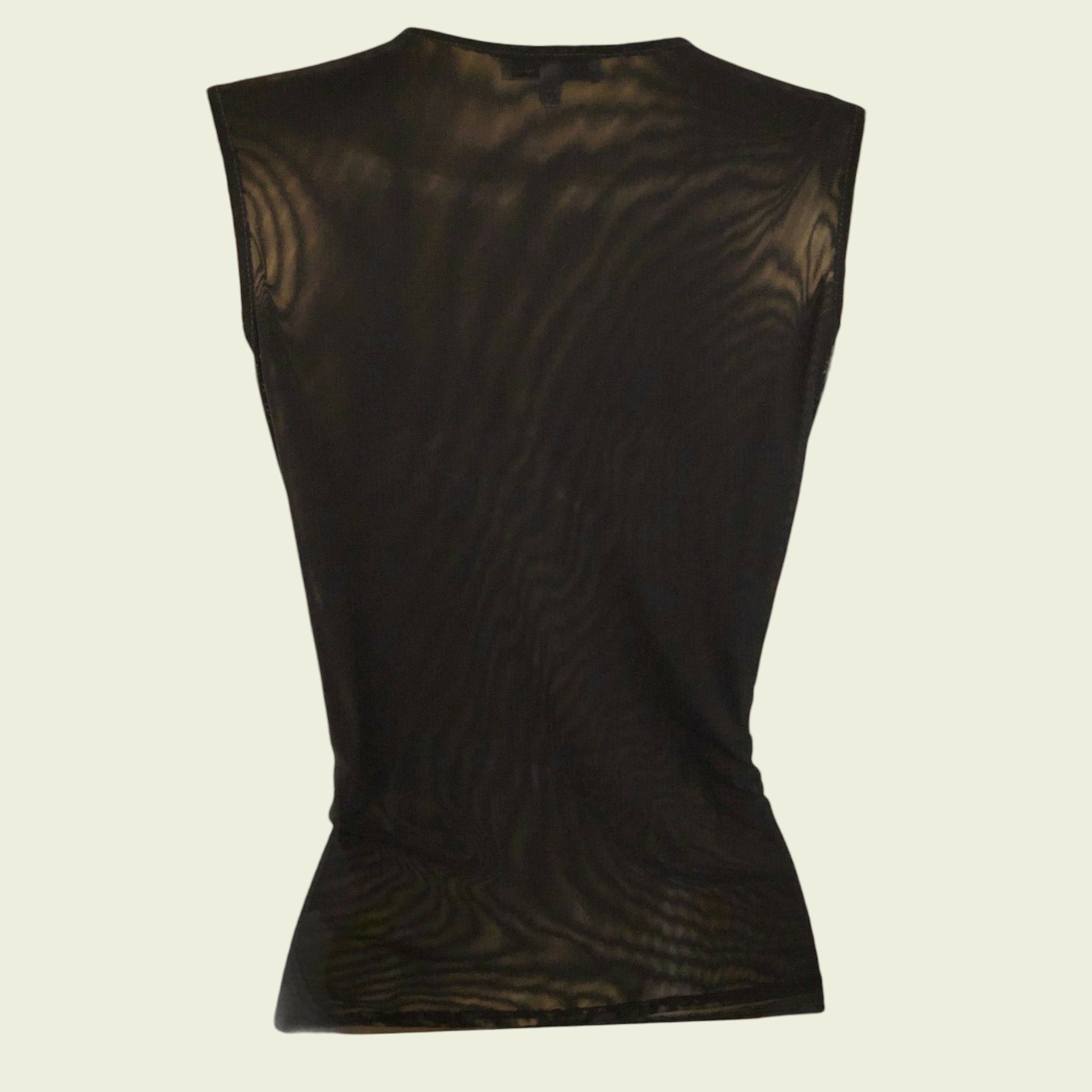 Back of black sleeveless top on a beige background