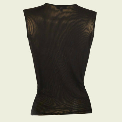 Back of black sleeveless top on a beige background