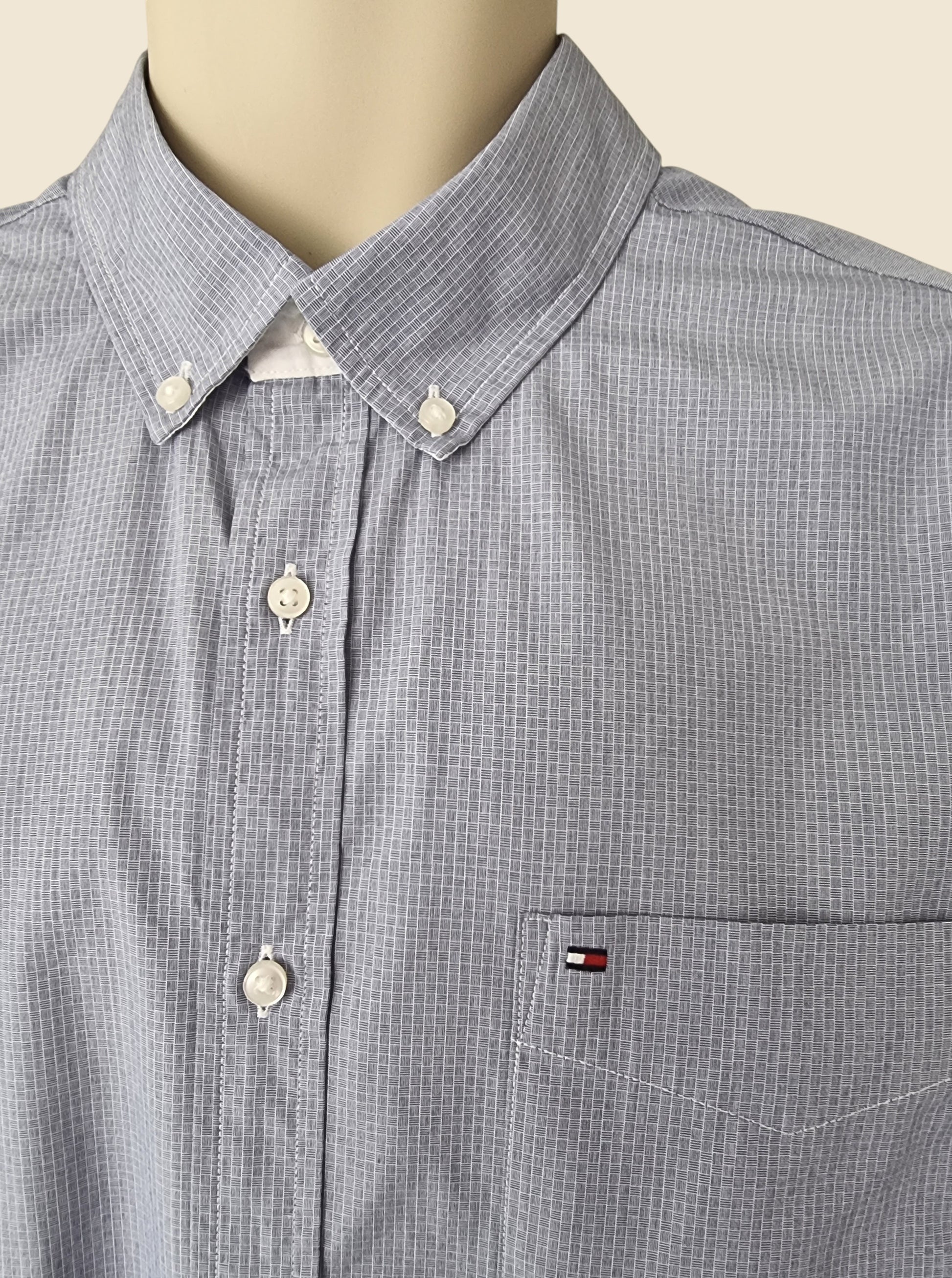 Blue checkered shirt on a mannequin with a visible brand logo.