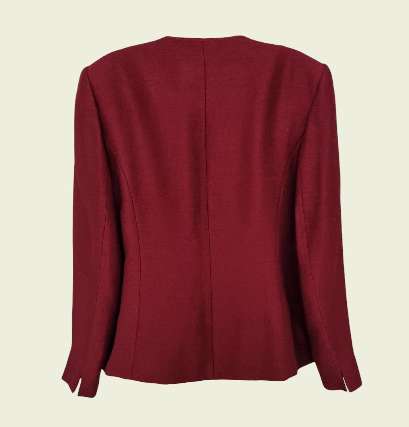 Maroon blazer on a beige background